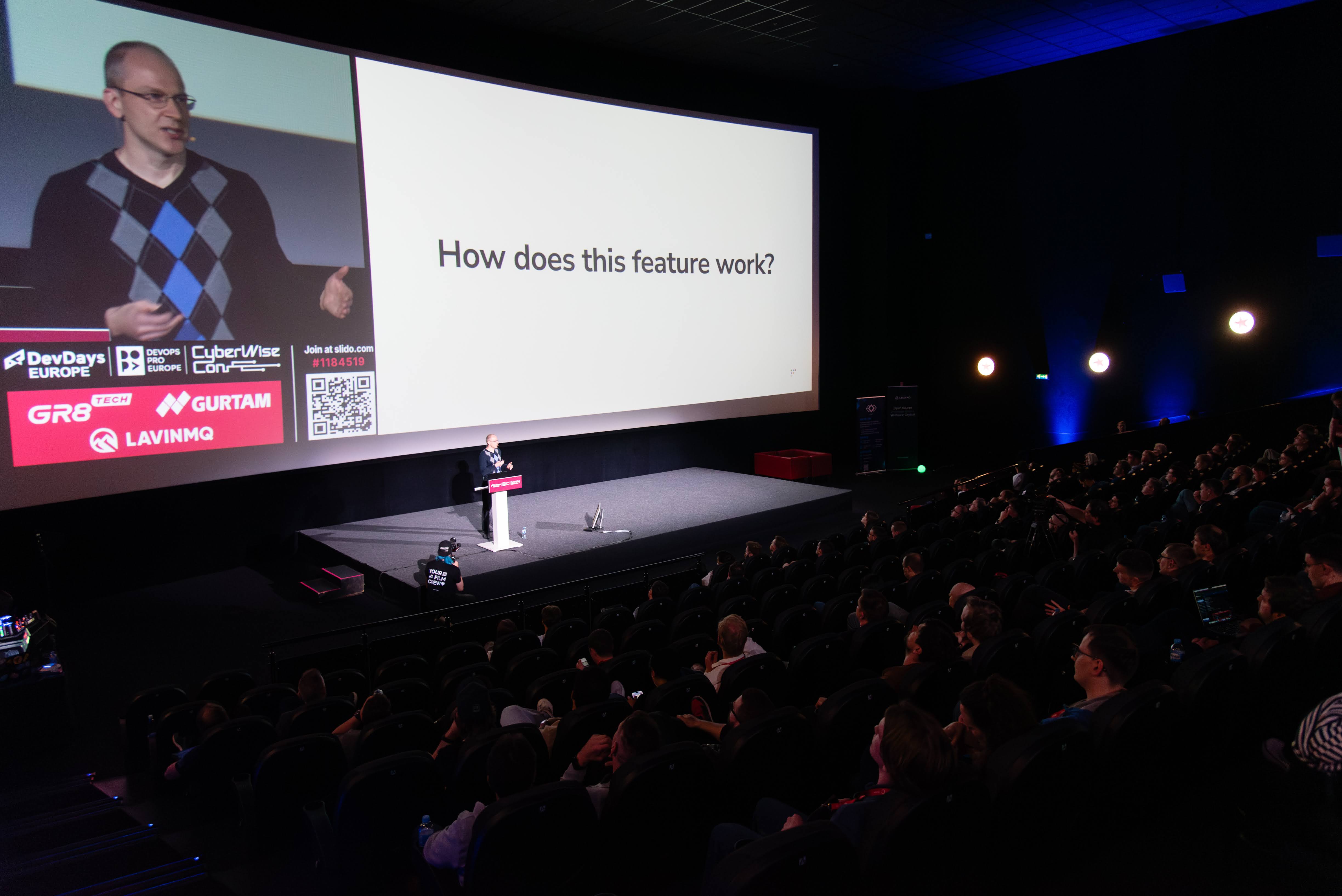 Victor on stage presenting.